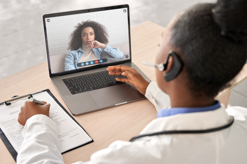 A healthcare provider conducting a telehealth consultation with an underserved patient, highlighting the role of virtual palliative care in improving healthcare access.