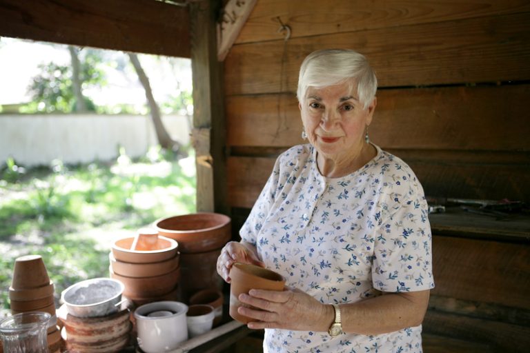 latin woman holding vase