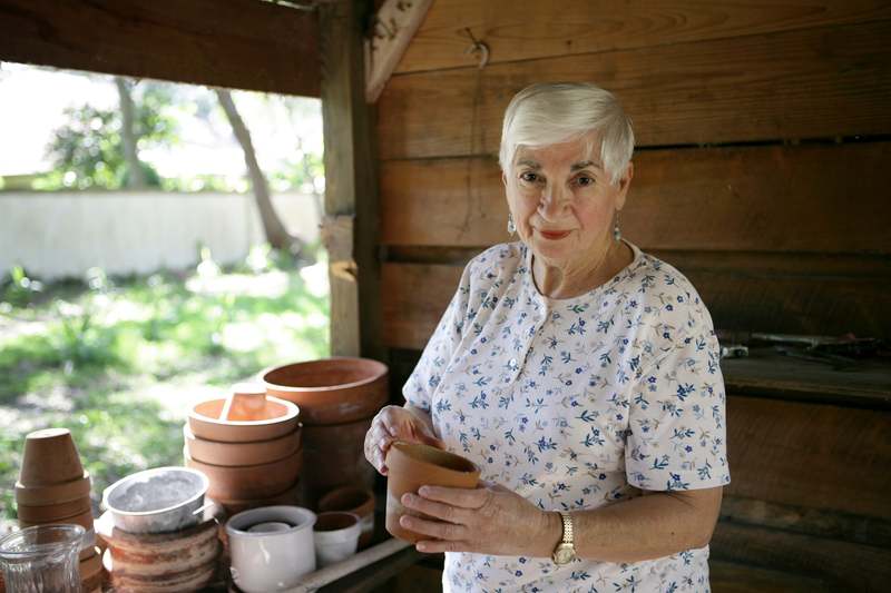 latin woman holding vase