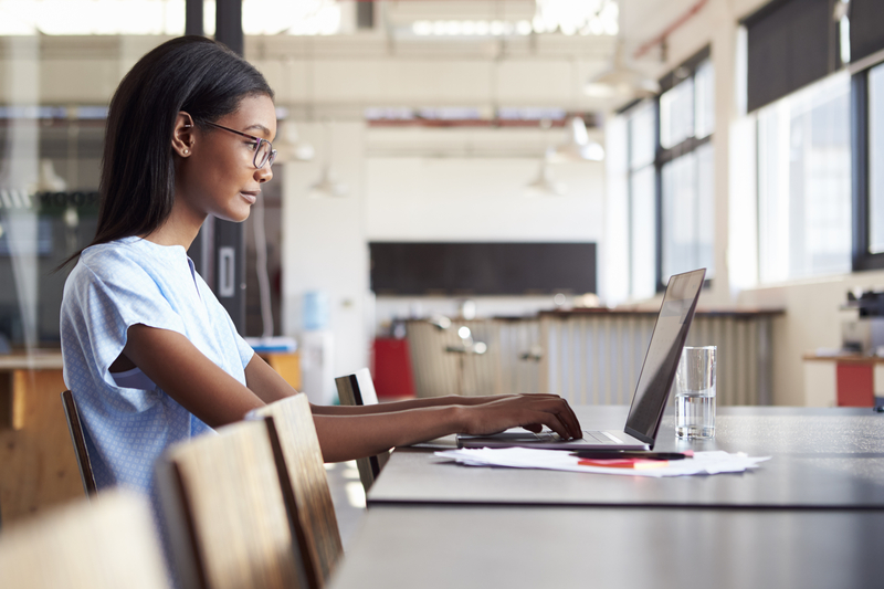 Black therapist working remotely with a client via video call
