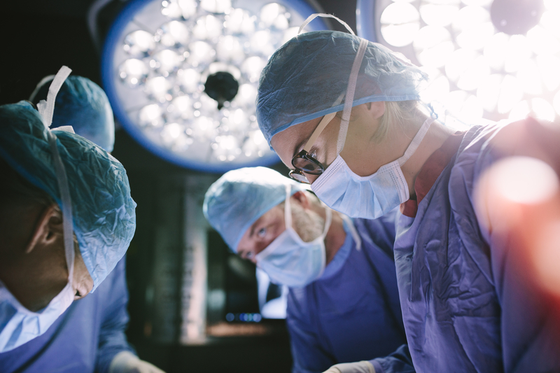 Audiologist adjusts a smart cochlear implant sound processor for a patient at MedStar Georgetown, symbolizing next-generation hearing restoration.