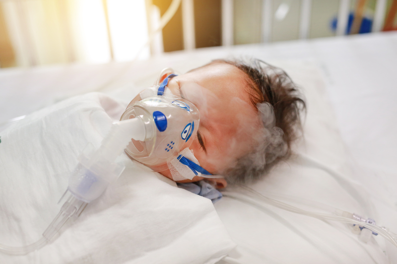 Infant Baby with oxygen mask in NICU with RSV.