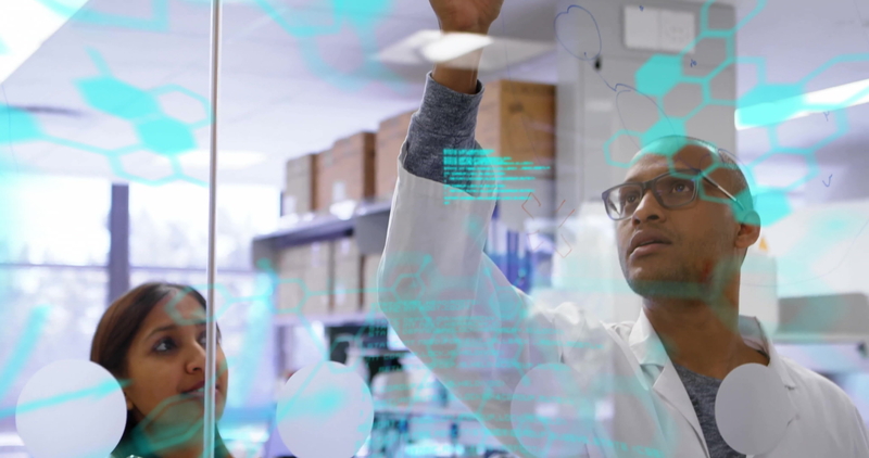 A diverse clinical research team collaborating in a modern lab, representing progress in FDA leadership, equity in clinical trials, and inclusive drug development