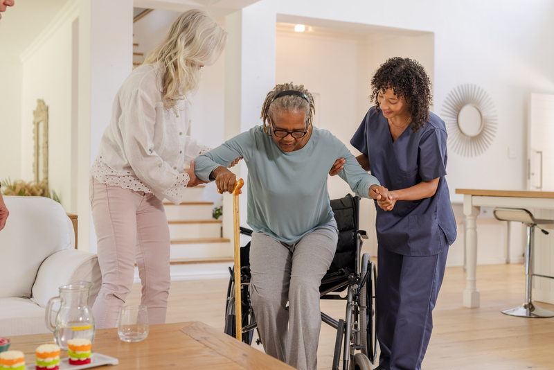 Diverse group of healthcare workers providing care in a community setting, representing job growth and economic opportunity in underserved neighborhoods