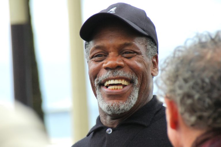 Danny Glover speaking during a public event, raising awareness about living with Alzheimer's disease and the importance of early diagnosis.